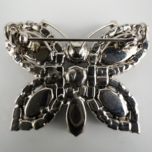 Sparkling , White Rhinestone Butterfly base Metal Brooch With Pendant.
