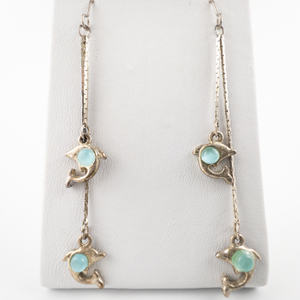 Pair Of Dolphins With Blue Stone Silver Tone base Metal Dangle Earrings.