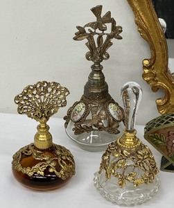 lot 228 image: Amazing Collection of Vintage Perfume Bottles and a Vintage Unique Gold Framed Mirror