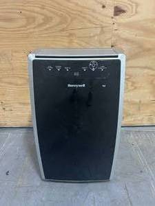 lot 127 image: HONEYWELL 10,000 BTU Portable Air Conditioner Cools 700 Sq. Ft. with Dehumidifier in Black and Silver