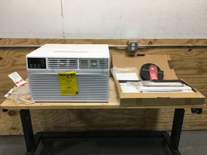 lot 142 image: Whirlpool 12000 BTU 115V Air Conditioner with Remote Model # WHAT121-1AW (Retails $599.99)