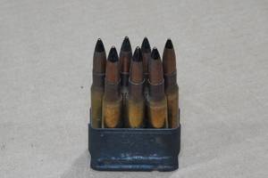 lot 177 image: Metal Cartridge with 7 .30-06 Black Tip Rounds