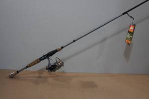 lot 31 image: Ozark Trail 7 OTX Spinning Rod & Reel Combo