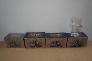 lot 43 image: 4 Lucky Shot Pint Glasses with Embedded Bullets