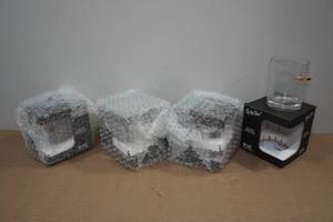 lot 44 image: 4 Lucky Shot Rocks Glasses with Embedded Bullets