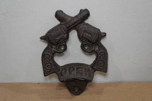 lot 108 image: Cast Iron Crossed Pistol Bottle Opener