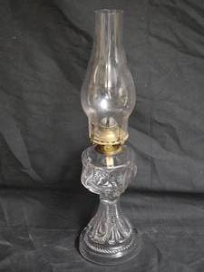 lot 24 image: Antique Clear Glass Oil Lamp with Ornate Brass Queen Anne No. 1 Burner