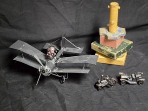 lot 51 image: Mixed Toy Lot Metal Biplane, Antique Cars, and Wooden Stacking Toy