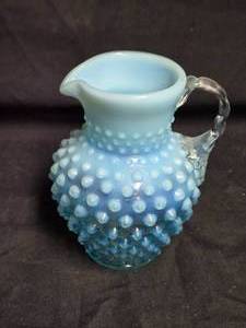 lot 183 image: Fenton Blue Opalescent Hobnail Pitcher with Clear Handle