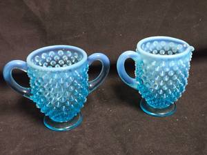 lot 188 image: Pair of Fenton Colonial Blue Opalescent Hobnail Sugar and Creamer Set