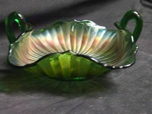 lot 213 image: Northwood() Green Carnival Glass Handled Bowl with Ribbed Pattern