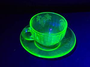 lot 243 image: Vintage Green Depression Uranium Glass Teacup and Saucer Set