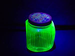 lot 261 image: Unique Nashs Toasted Coffee Jar with Ribbed Uranium Glass and Original Lid, About 8 12 Tall