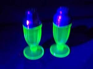 lot 270 image: Green Uranium Glass Salt and Pepper Shakers with Ribbed Design and Metal Lids