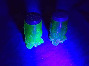 lot 274 image: Green Uranium Glass Salt and Pepper Shakers with Metal Lids