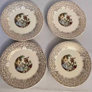 lot 446 image: Four Vintage Triumph American Limoges Plates