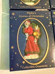 lot 180A image: Four Pipkas Stories of Christmas Santa Christmas Ornaments includes Pipkas Stories of Christmas Dear Santa Ornament