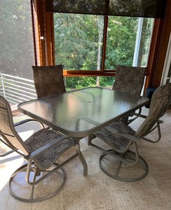 lot 1 image: High End Patio Set - Glass Table with 4 Swivel Chairs