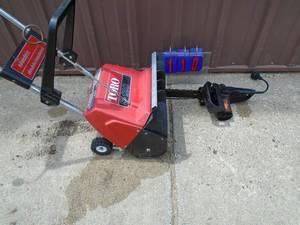 Toro 110 volt snothrower. Never can tell. & 110 volt chainsaw. Both tested & works. As shown.