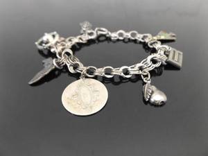 lot 58 image: .925 Sterling Silver 7 Charm 7.5 Charm Bracelet