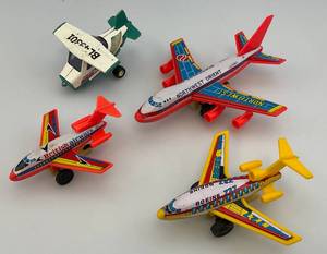lot 59 image: Misc. Tin Litho And Plastic Friction Airplanes