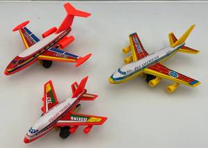 lot 60 image: Misc. Tin Litho And Plastic Friction Airplanes