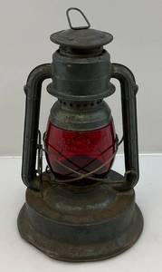 lot 128 image: Vintage Dietz Little Giant Oil Lamp With Red Glass Lense (Has Crack)