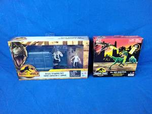 lot 144 image: New Jurassic World HFG63 Cage and Fury Dinosaur Set and Jurassic Park 93 Classic Dr. Ian Malcolm Glider Escape Pack