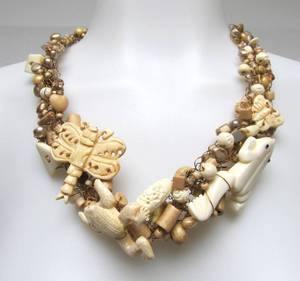 lot 34 image: LARGE & Whimsical Copper Wire Necklace wMany Hand Carved Interesting Beads