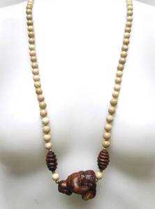 lot 35 image: Carved Wood Seated Buddha Pendant Necklace