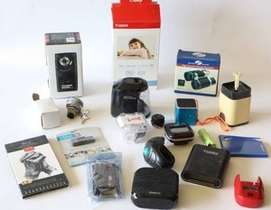 lot 61 image: Canon Selphy CP Compact Photo Printer Color InkPaper Set KP-1081N, Sylvania HD Digital Video Camera, Logitech Revue Etc.