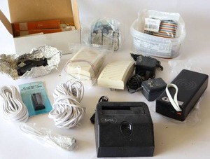 lot 63 image: TechniciansDigital Clock Parts, Chargers, Cables, Batteries Etc.