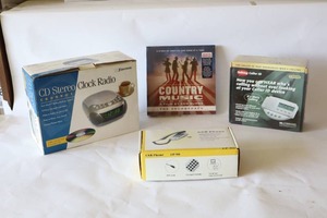 lot 244 image: Country Music A Film by Ken Burns The Soundtrack Deluxe Edition Box Set, Emerson CD Stereo Clock Radio, VoIP Internet Phone, Talking Caller I.D. Answering Machine