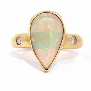 lot 14 image: Contemporary Pear White Opal Cabochon & Diamond Three-Stone Bezel Ring in 14k Yellow Gold