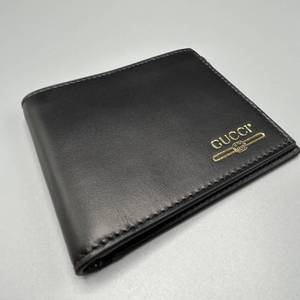 lot 21A image: Brand New Gucci Gold Logo Leather Bifold Wallet - Authentic $400 Retail