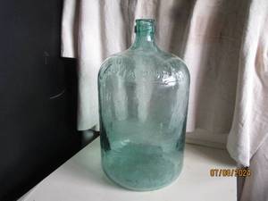 lot 24 image: Vintage green glass 5-gallon Carboy...