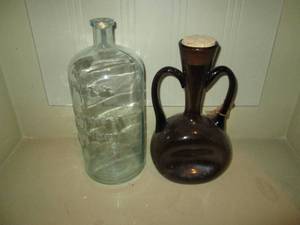 lot 487 image: (2) Mexican moonshine and water style glassware jugs