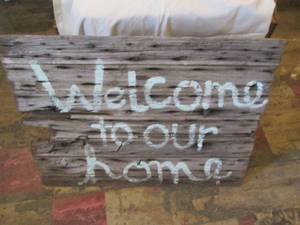 lot 221 image: Vintage barnwood and cast iron Welc...