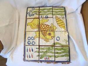 lot 227 image: Glazed tile puzzle style fish mural...