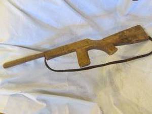 lot 334 image: Vintage wood Hand carved rifle with leather strap