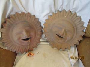 lot 162 image: Pair of Smiling Sun clay wall decor...