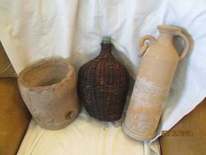 lot 540 image: Clay vessels and a glass jug with a woven shell