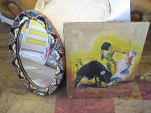 lot 548 image: Matador hand painted on canvas, has some damage and a ceramic framed mirror