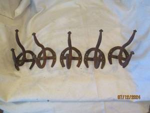 lot 570 image: Horseshoe coat hooks...