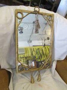 lot 304 image: Vintage 1624 brass tone framed wall mirror with rope and tussle accents