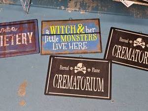 lot 1354 image: Lot of (4) w Metal Halloween Dcor Signs - Eternal Creatorium, Cemetary, A With and Her Monsters Lives Here