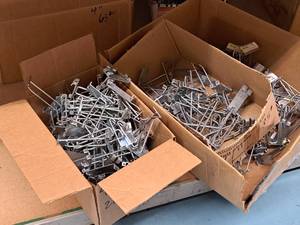 lot 445 image: Lot of (50) 4 Grid Wall Peg Hooks