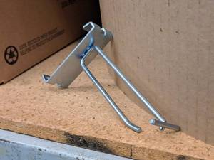 lot 446 image: Lot of (50) 4 Grid Wall Peg Hooks