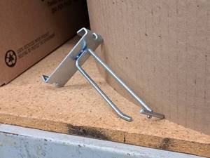 lot 447 image: Lot of (50) 4 Grid Wall Peg Hooks