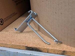 lot 448 image: Lot of (50) 4 Grid Wall Peg Hooks